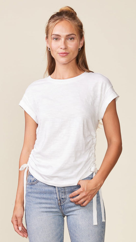 Relaxed, slightly shaped tee with high round neck, semi-relaxed dolman short sleeves with cuffs, adjustable ruched side ties on either side for added shape and rounded hem cotton slub white