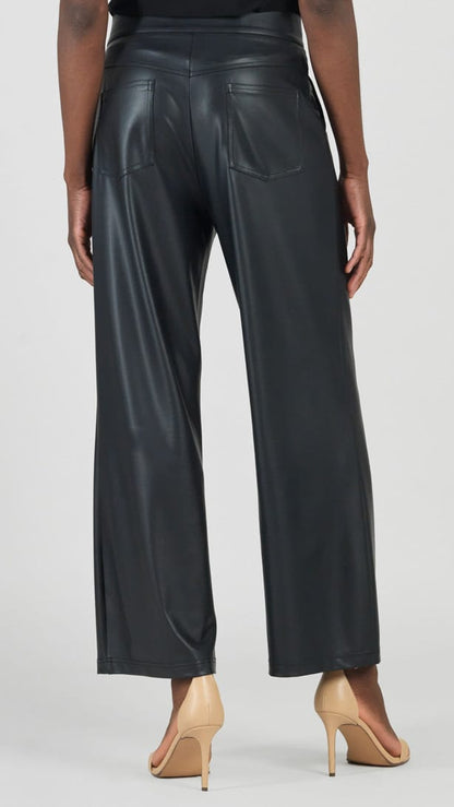 A model shown from the back wearing black wide-leg faux leather pants and beige high-heeled sandals against a light gray studio background.