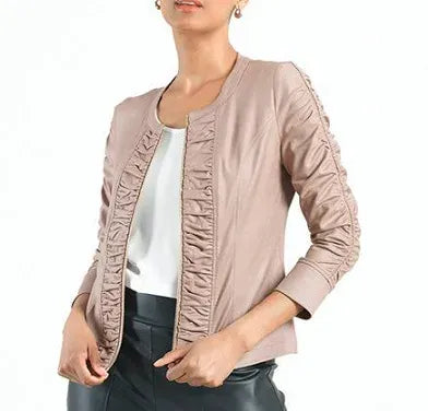 Woman wearing a light brown bomber jacket on a white background