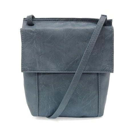 Vegan leather crossbody with front flap, adjustable shoulder strap and zipper pocket