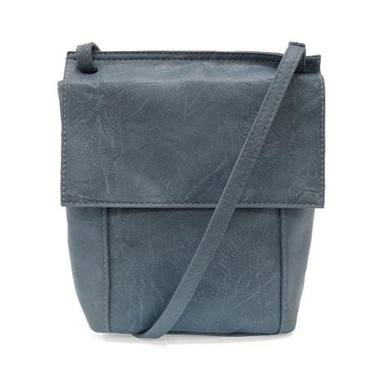 Vegan leather crossbody with front flap, adjustable shoulder strap and zipper pocket
