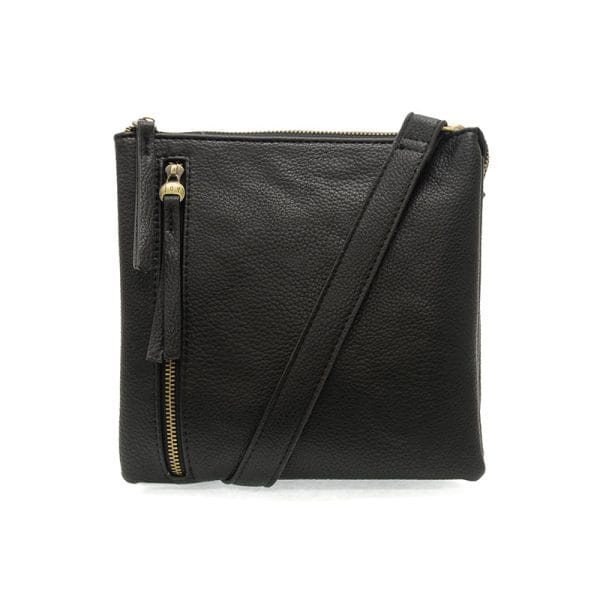 Joy Susan vegan leather crossbody with top zip closure, off center zip detail and removable adjustable shoulder strap