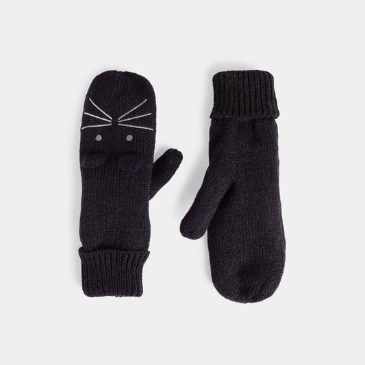 A pair of black knit mittens on a light gray background. One mitten features a white embroidered cat face design with whiskers and eyes, while the other is plain.