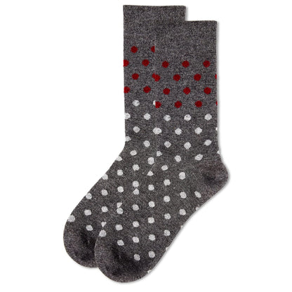 Gray socks with red and white polka dots on a white background