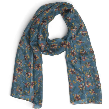 A lightweight blue silk scarf with a dense, multicolored floral print, draped in a loop against a plain white background.