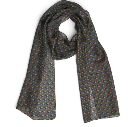 A lightweight silk scarf with a repeating geometric pattern in muted shades of blue, green, and gold on a dark gray base, displayed against a plain white background.