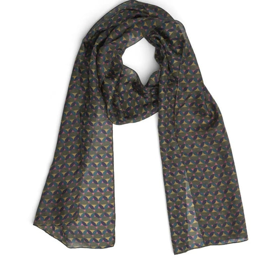 A lightweight silk scarf with a repeating geometric pattern in muted shades of blue, green, and gold on a dark gray base, displayed against a plain white background.
