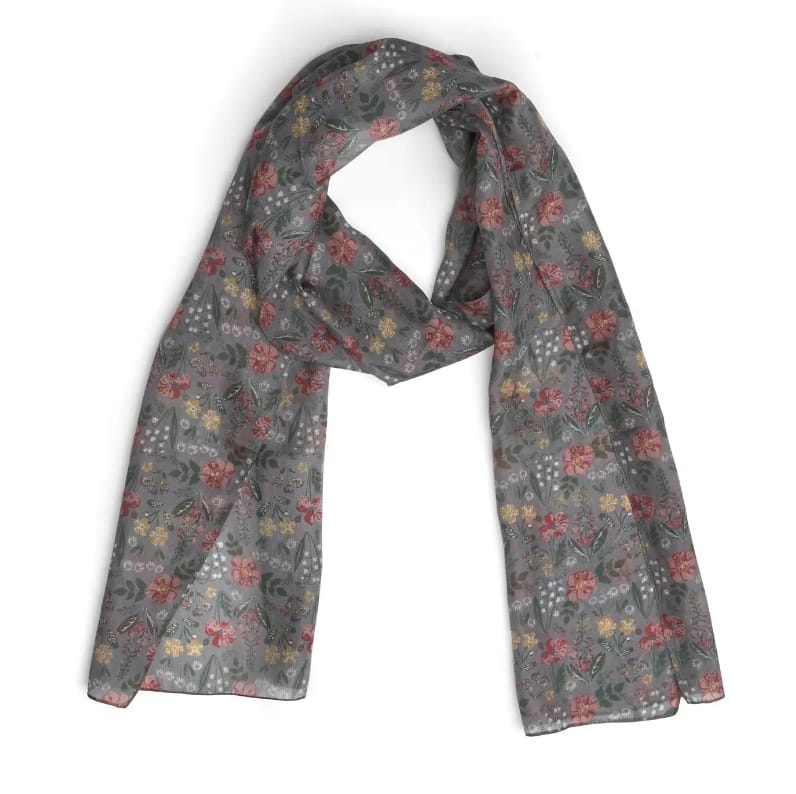 A lightweight gray silk scarf with a dense, all-over floral and paisley print in muted red, yellow, and green tones, draped on a plain white background.