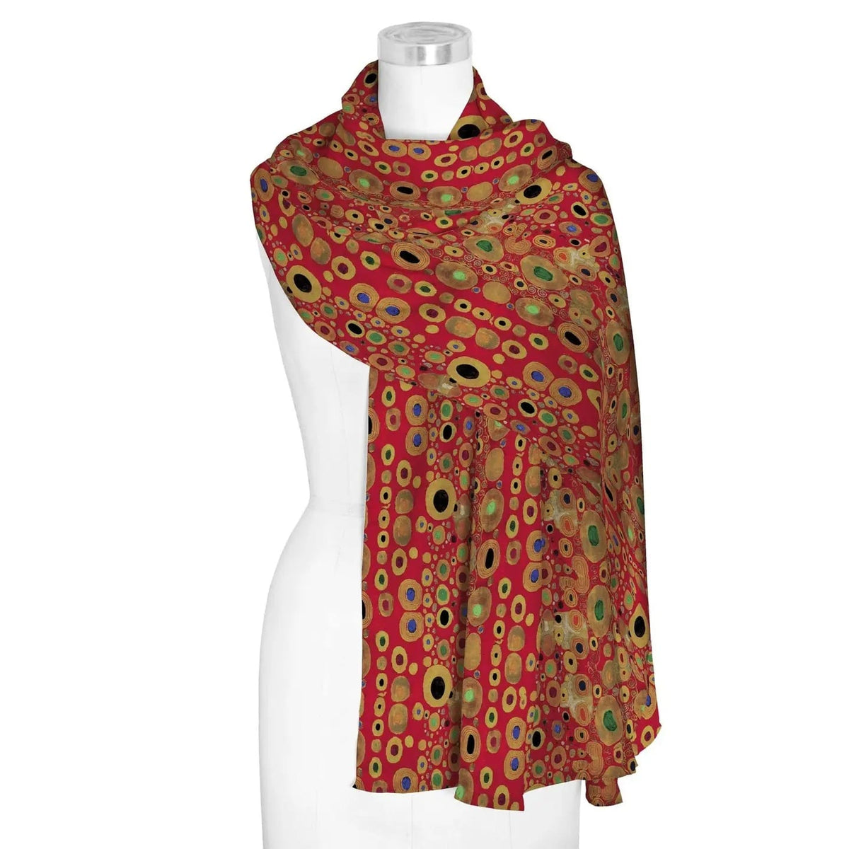 Colorful patterned scarf on a mannequin against a white background