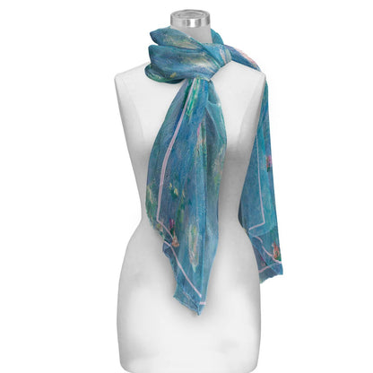 Mannequin wearing a blue patterned scarf on a white background