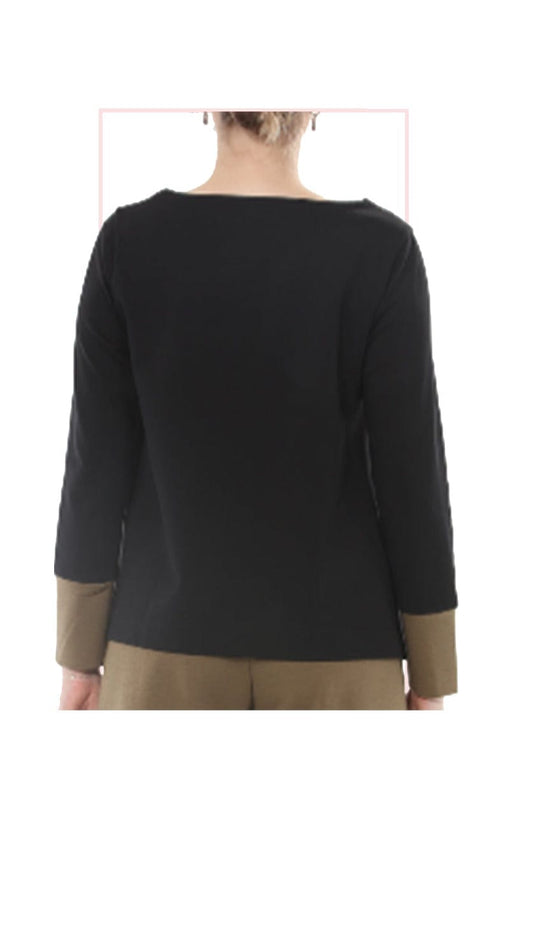 A woman shown from the back wearing a black long-sleeve top with contrasting tan cuffs, against a plain white background.