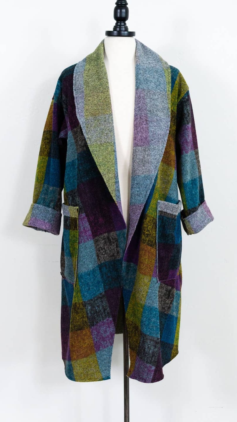A multicolor plaid wool-blend cardigan with a shawl collar and three-quarter sleeves, displayed on a white mannequin torso against a white background.