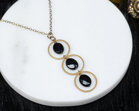 Edgy Petal Triple Black Onyx Circle Necklace
